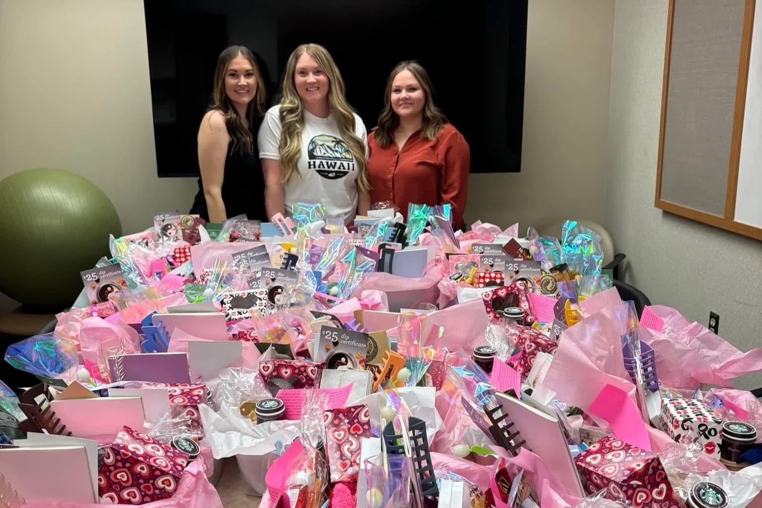 Volunteers with a room full of finished Mother’s Day care baskets